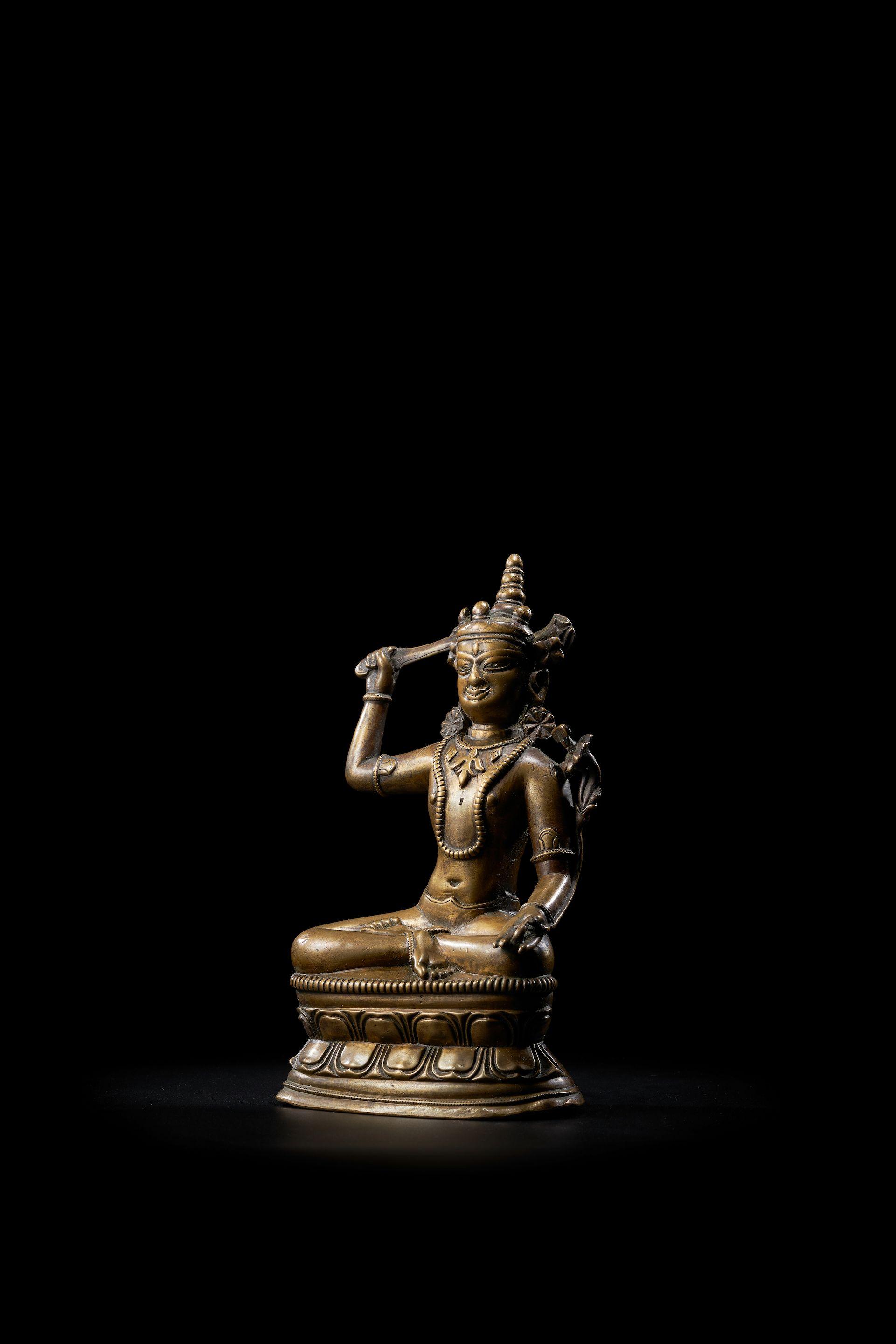 A Copper Alloy Figure Of Manjushri