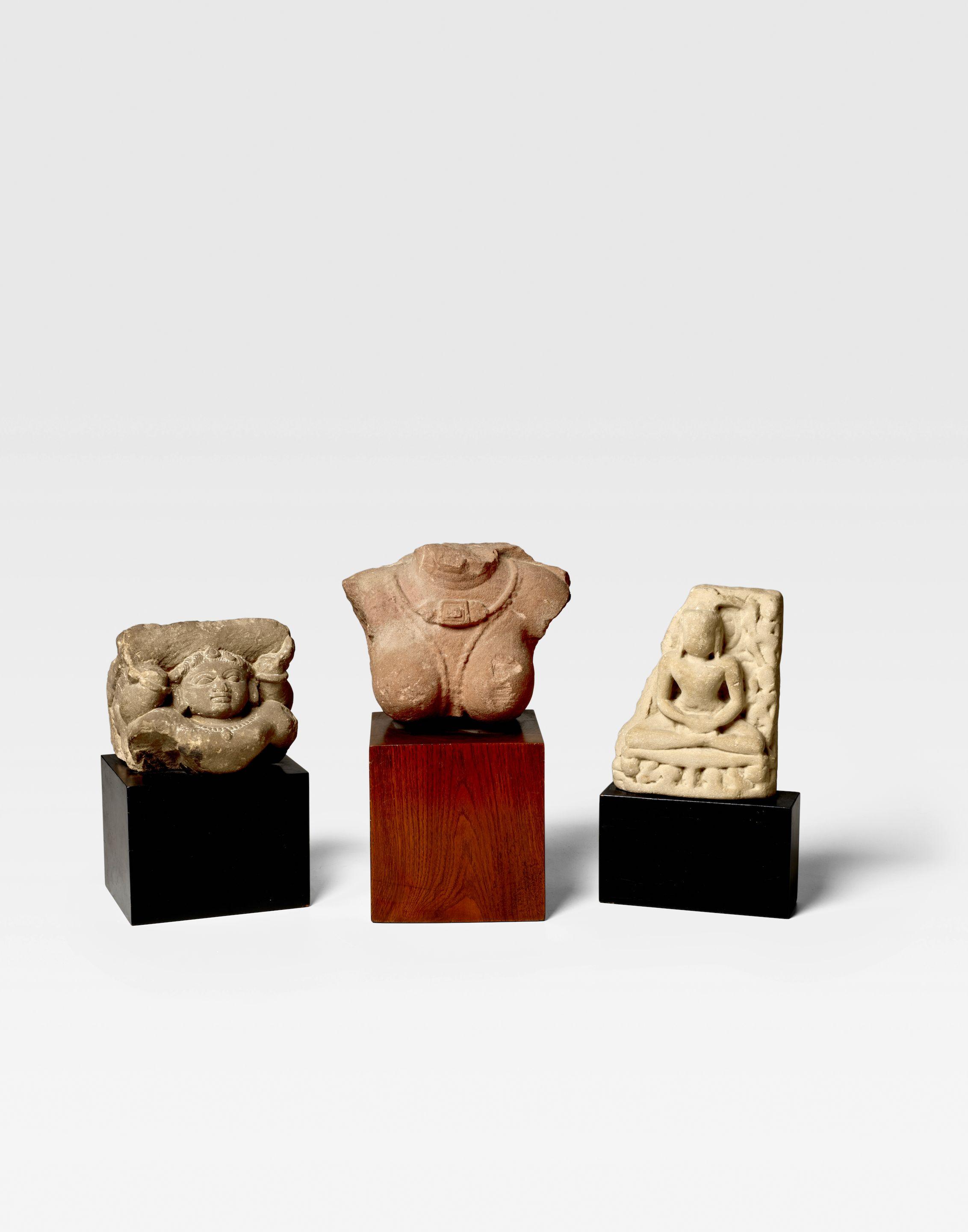 A Group Of Three Sandstone Sculptures