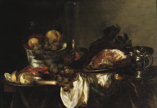 Abraham Van Beijeren - A blue and white porcelain bowl with fruit, a \'façon de Venise\' of white wine, a leg of ham on a silver platter, a silver jug, a pocket watch, a silver plate with a peeled lemon and a crab all on a partially draped table