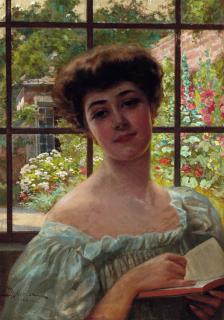 Adolfo Belimbau - Portrait Of A Lady, Bust Length, In A White Summer Dress Holding An Open Book; A Walled Summer Garden Beyond