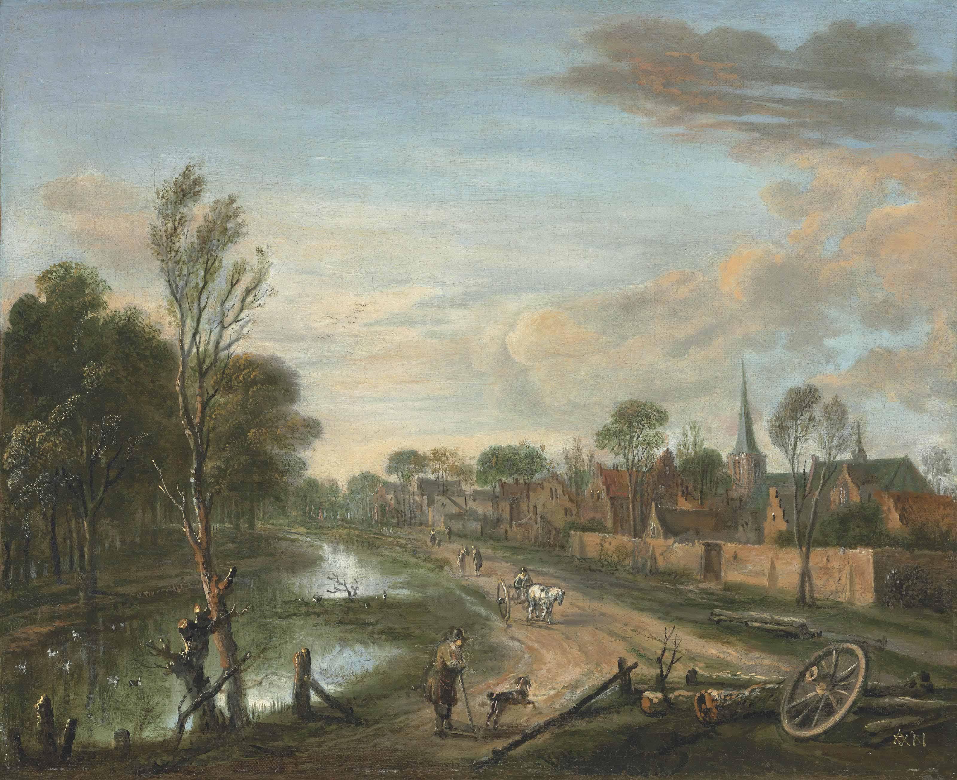 Aert Van Der Neer - A wooded landscape with travellers on a path by a canal, a town beyond