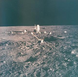 Alan Bean - Apollo 12: Charles Conrad Jr. aligns antenna on the ALSEP.