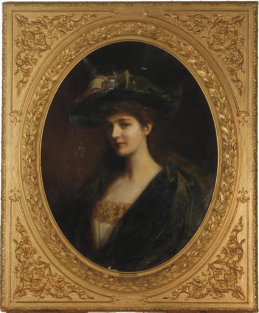 Albert Lynch - Portrait Of A Young Beauty In A Green Hat And Robe