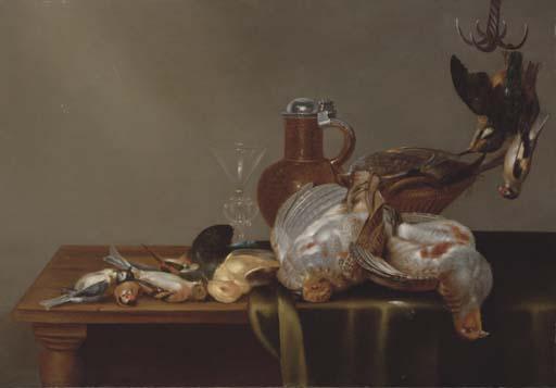 Alexander Adriaenssen - A blue tit, a red finch, a patridge, a kingfisher, and other dead birds on a half draped table, with a glass and silver rimmed jug