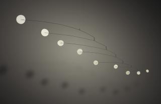 Alexander Calder - Nine Snowflakessigned With The Artist\'S Monogram And Dated 70; Painted Metal And Wire Mobile.