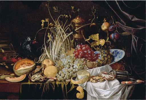 Alexander Coosemans - A Dutch Delft blue and white bowl with grapes, prawns on a pewter plate, crabs, a partly-peeled lemon and a melon on a partly-draped table with a parrot eating a cherry