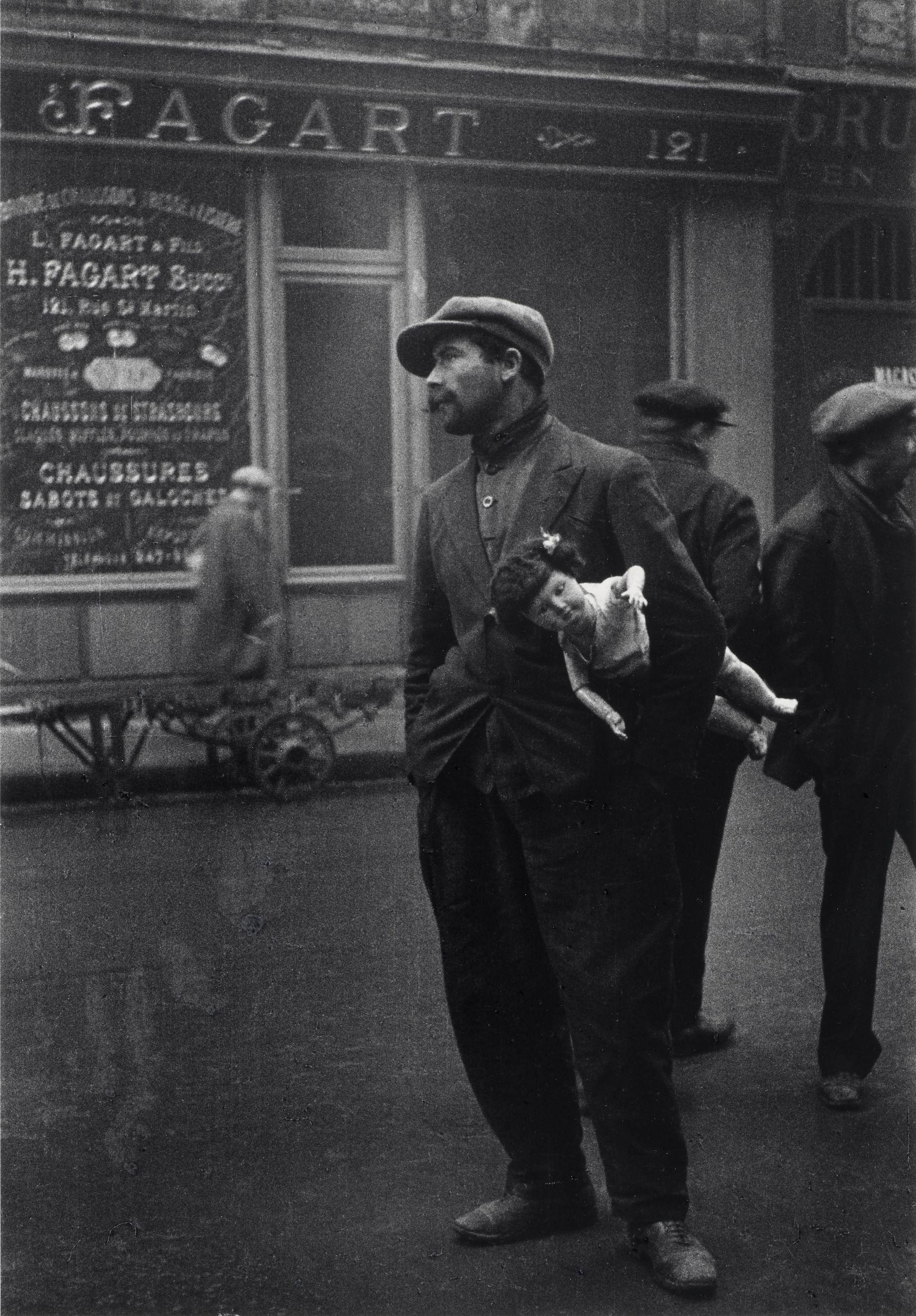 Alfred Eisenstaedt - Man with Doll near Rue St. Denis, Old Section of Paris