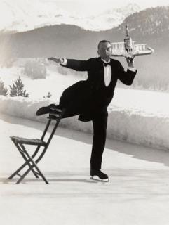 Alfred Eisenstaedt - Skating Waiter Rene Breguet Serving Cocktails at the Grand Hotel, St Moritz