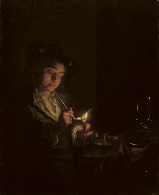 Arnold Boonen - A candlelit interior with a young man seated at a table, lighting his pipe