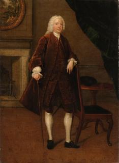 Arthur Devis - Portrait of a gentleman, full-length, in a brown coat and waistcoat, his left arm resting on a chair, his right hand holding a cane, in an interior