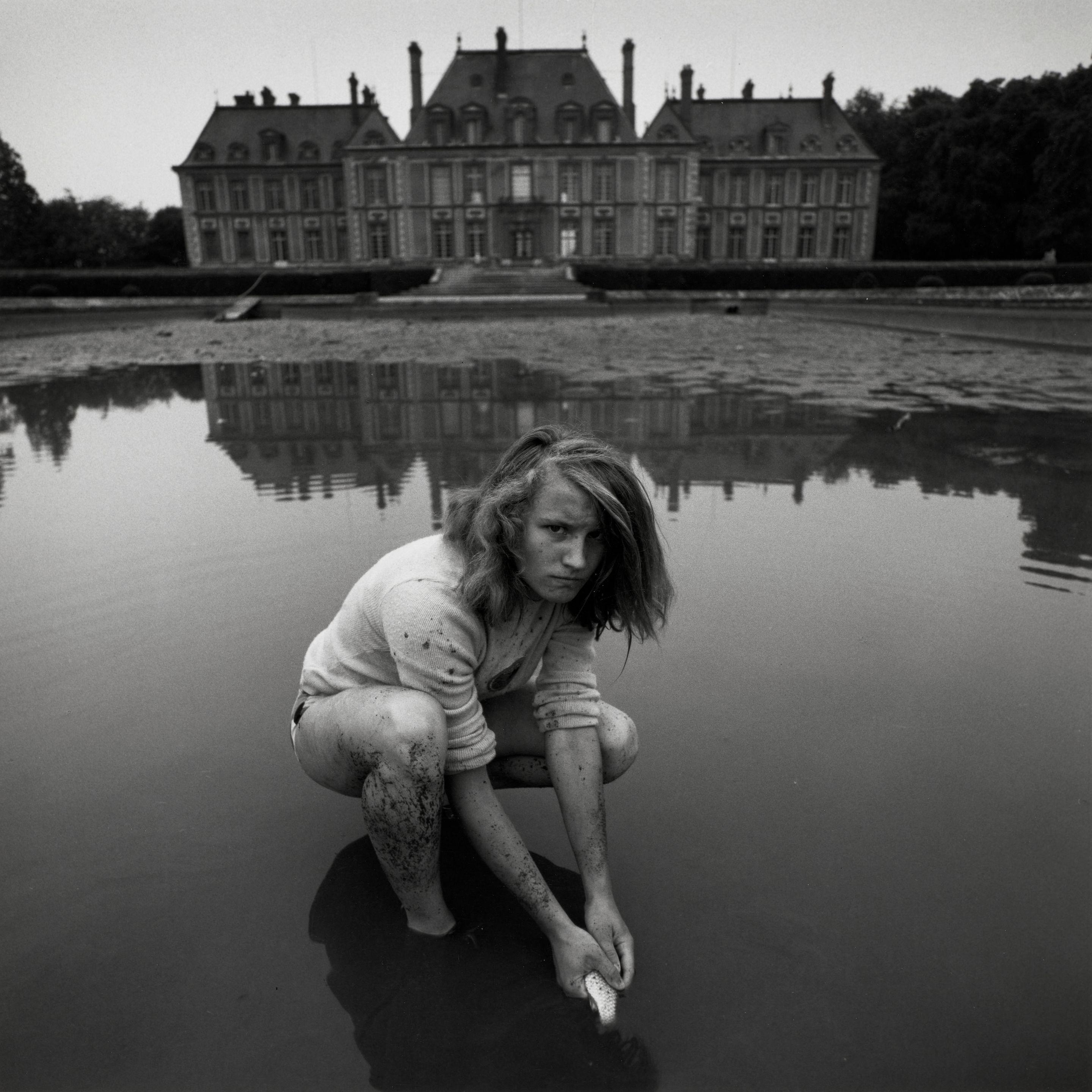 Arthur Tress - Girl Catching Goldfish, Chateau Breteuil, France