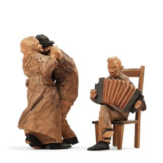 Axel Petersson Döderhultarn - Seated accordionist and dancing couple