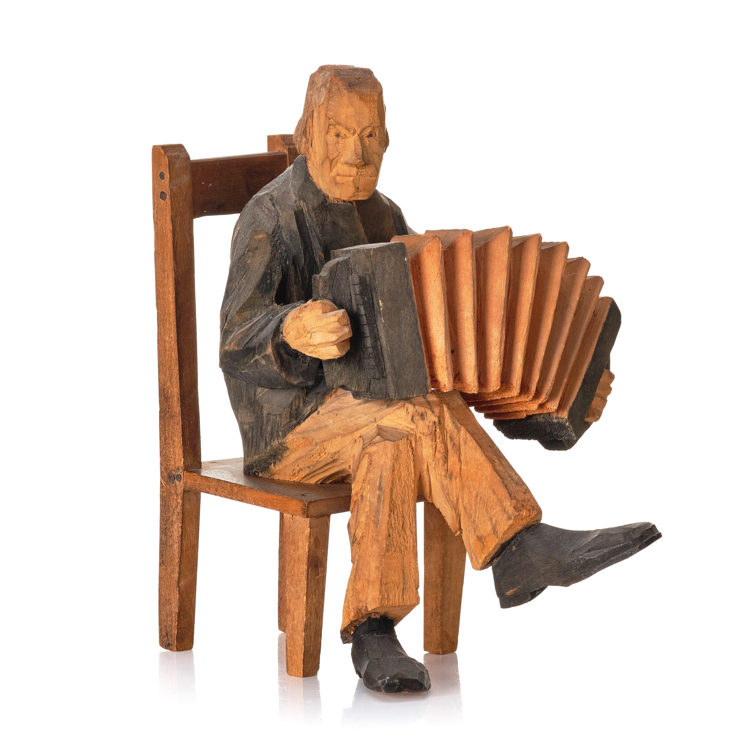 Axel Petersson Döderhultarn - Seated accordionist