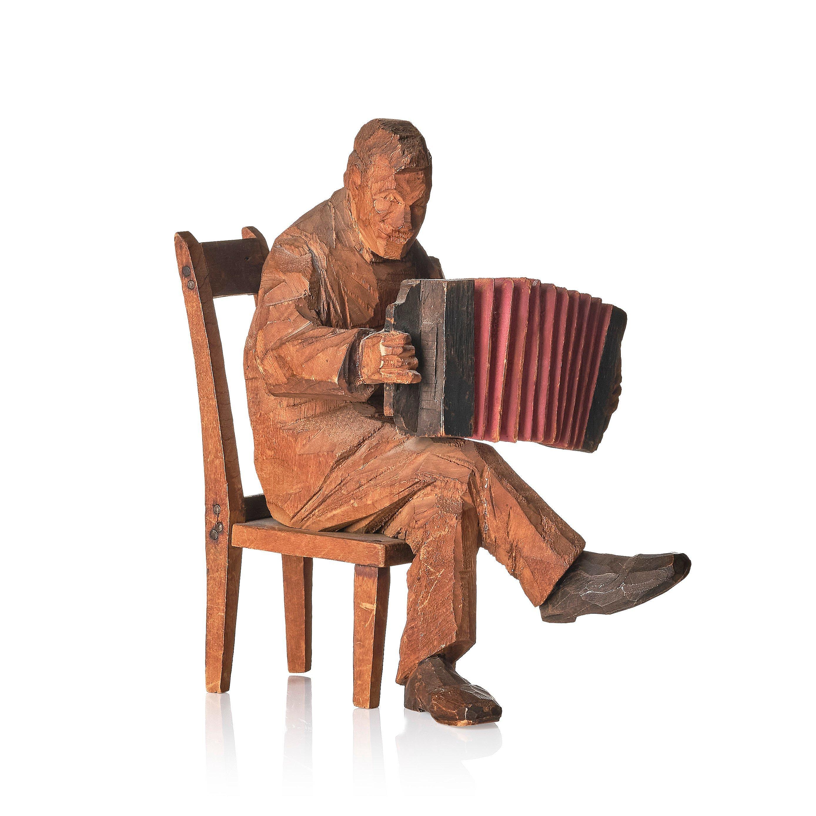 Axel Petersson Döderhultarn - Seated accordionist