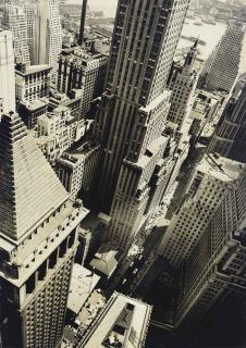 Berenice Abbott - Wall Street showing East River from roof of Irving Trust Co. Building, May 4, 1938