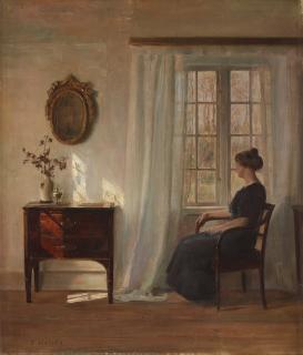 Carl Holsoe - Interior with seated woman by the window