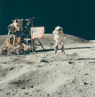 Charles Moss Duke - Apollo 16: J. Young leaps from lunar surface to salute the flag.