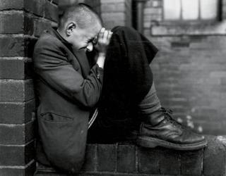 Chris Killip - Youth on wall, Tyneside, 1976