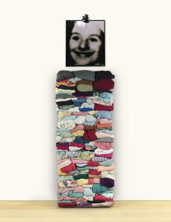 Christian Boltanski - Monument : La Fête De Pourimfolded Clothes, Stacked On A Wood Panel, Black And White Photograph, Electrical Lamp. Executed In 1989.