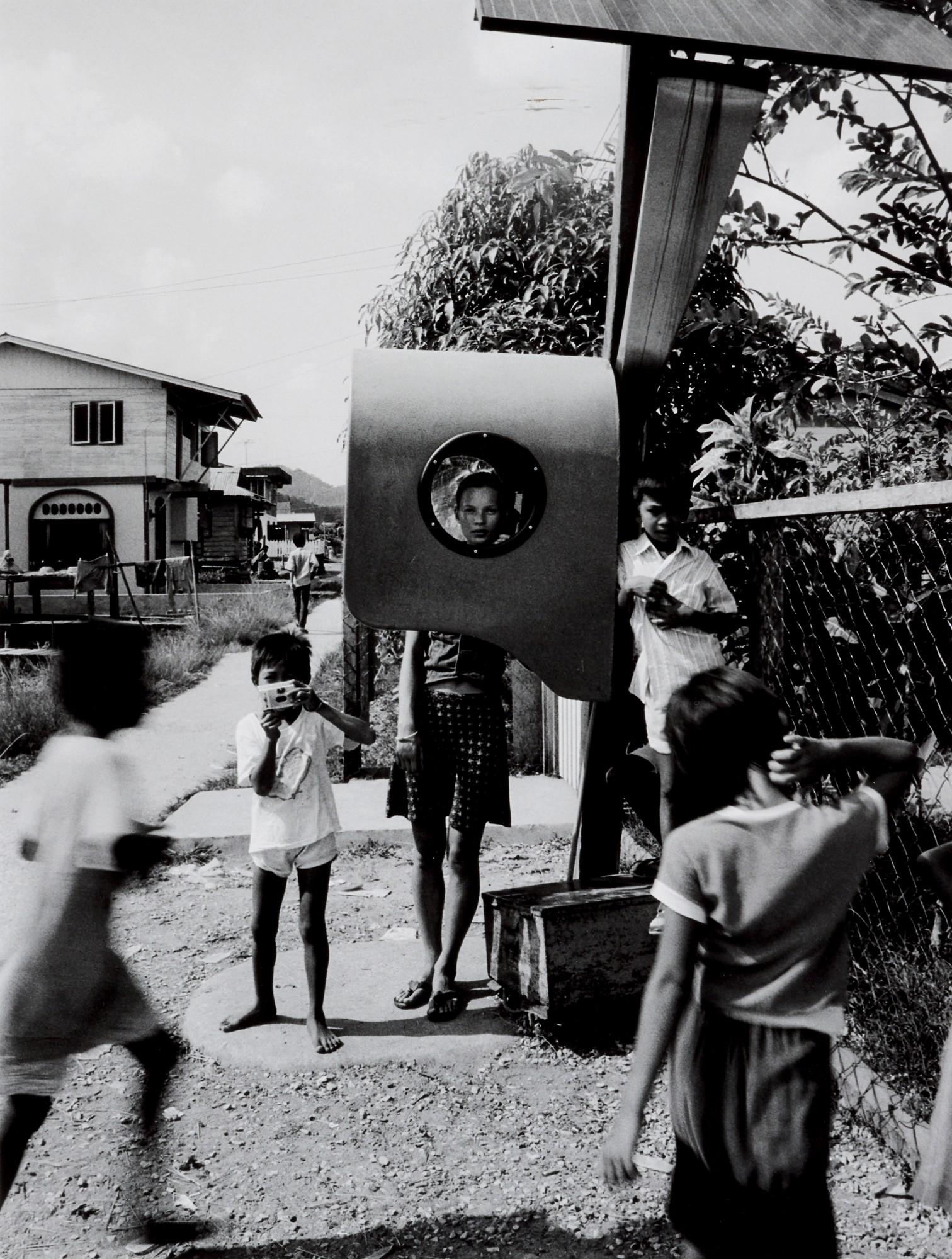 Corinne Day - Kate Moss In Phone Booth, Borneo, 1991