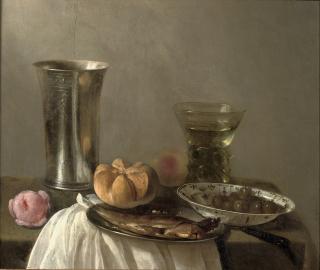 Cornelis Kruys - A silver beaker, a herring on a pewter plate, a \'wan-li\' bowl with olives and a \'Roemer\', all on a partially draped table