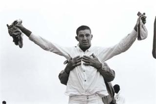 Danny Lyon - Untitled (Prisoner Being Patted Down) From Conversations With The Dead, 1968
