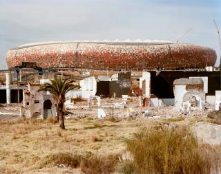 David Goldblatt - Soccer City stadium and the ruins of Shareworld. The Stadium was built especially the 2010 soccer World Cup. Shareworld was a theme park for the people of Soweto, it was built and went bankrupt in the 1980s. 6 June 2009
