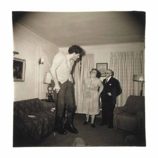 Diane Arbus - A Jewish giant at home with his parents in the Bronx, N.Y., 1970