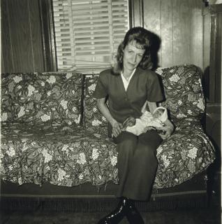 Diane Arbus - A woman with her baby monkey, N.J. 1971