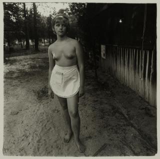 Diane Arbus - A young waitress at a nudist camp, NJ