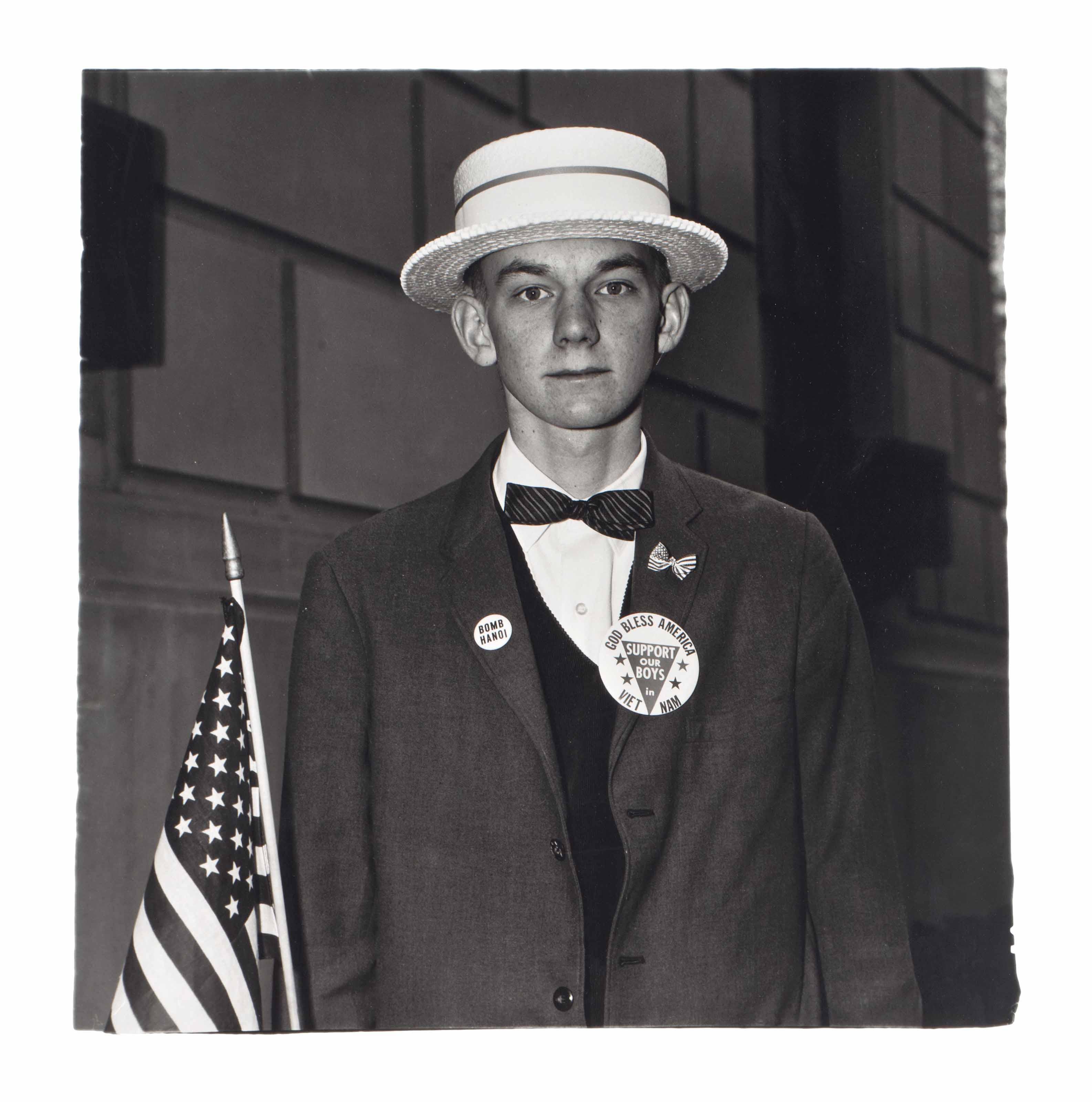 Diane Arbus - Boy With A Straw Hat Waiting To March In A Pro-War Parade, N.Y.C., 1967