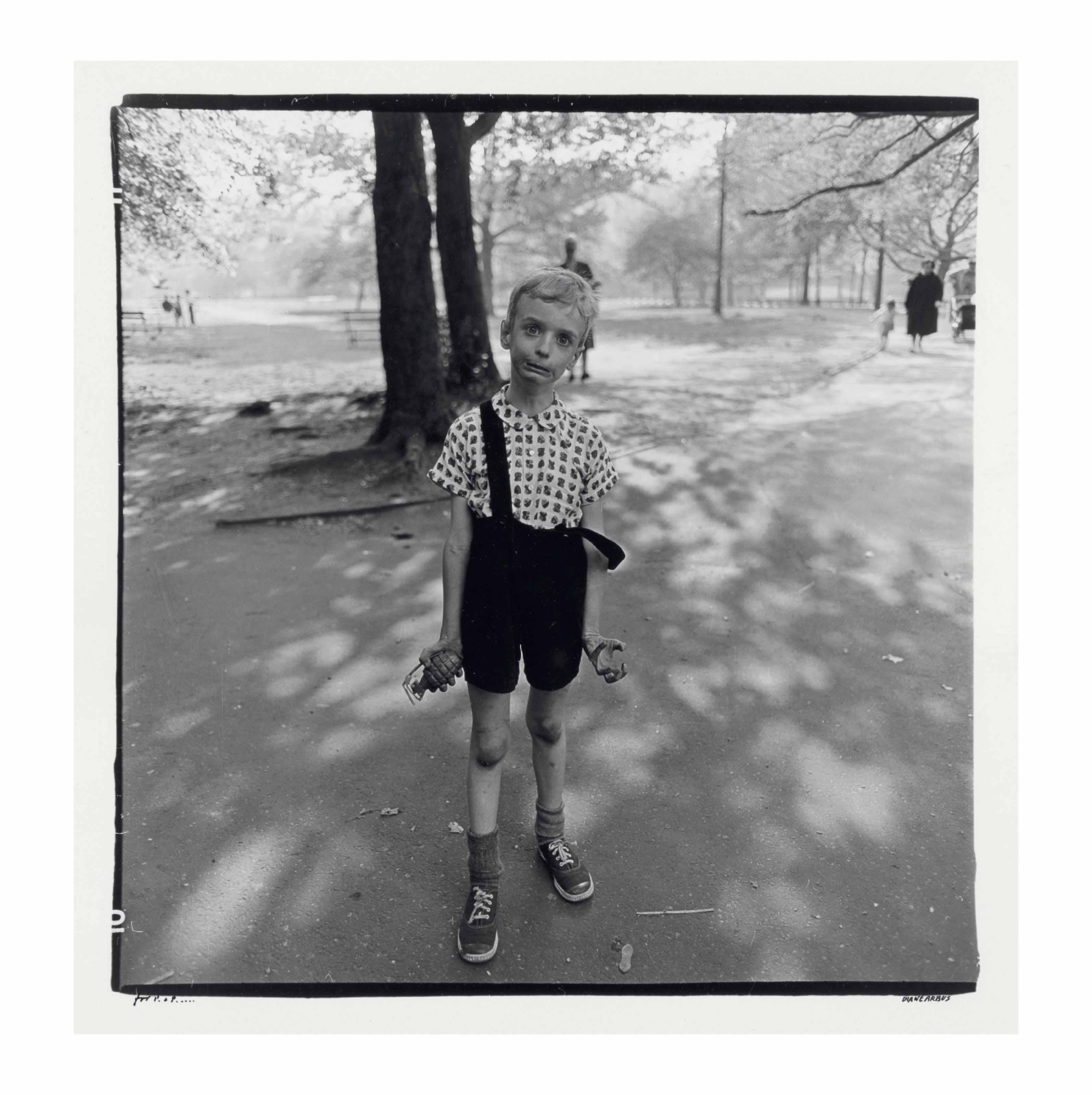 Diane Arbus - Child with a toy hand grenade in Central Park, N.Y.C., 1962