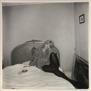 Diane Arbus - Girl In A Coat Lying On Her Bed, 1968