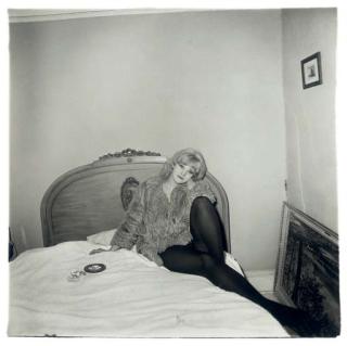 Diane Arbus - Girl in a coat lying on her bed, N.Y.C., 1968