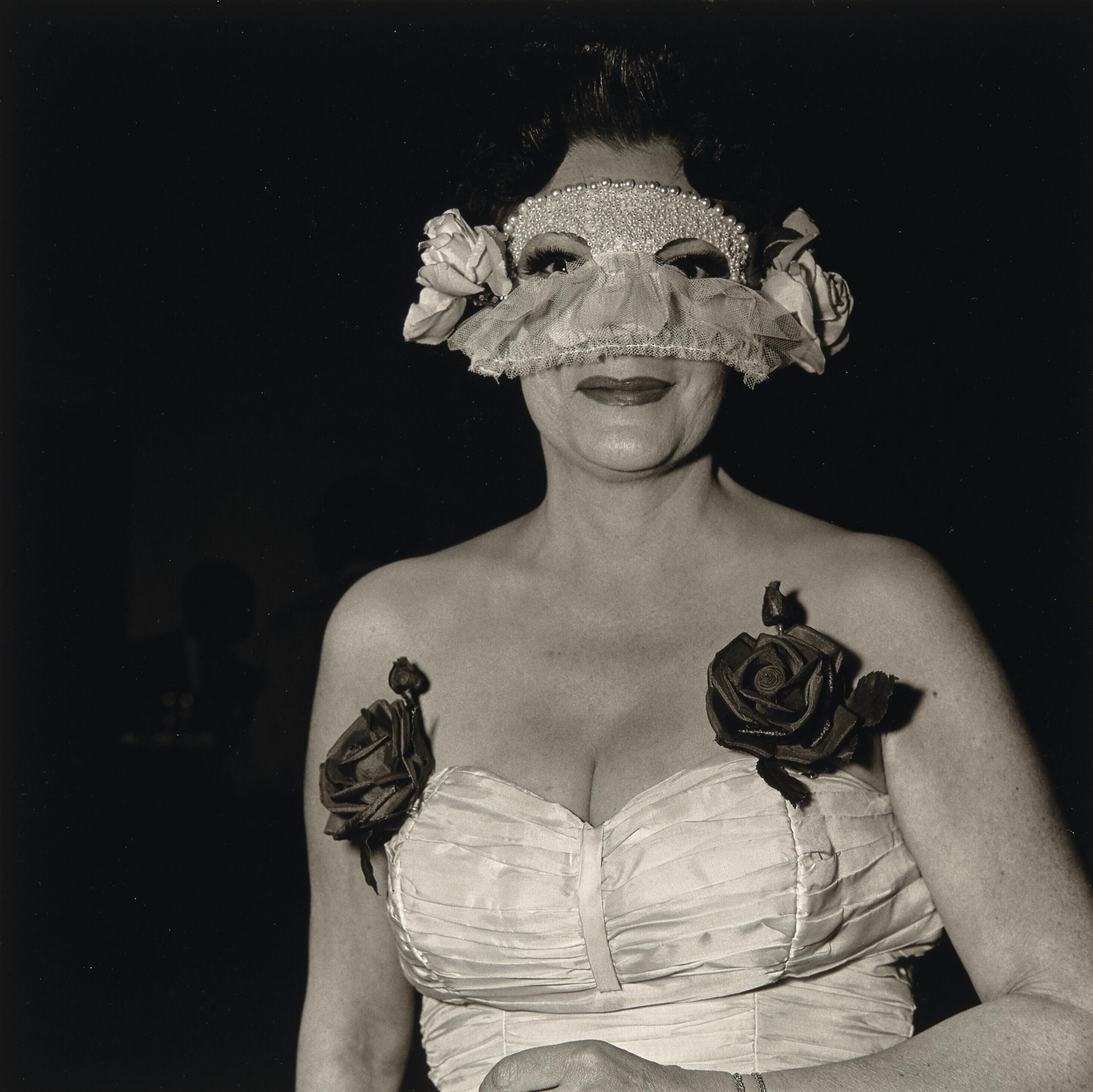 Diane Arbus - Lady at a masked ball with two roses on her dress, N.Y.C., 1967