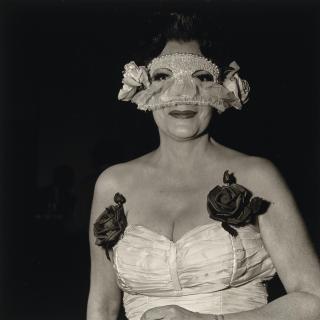 Diane Arbus - Lady at a masked ball with two roses on her dress, N.Y.C., 1967