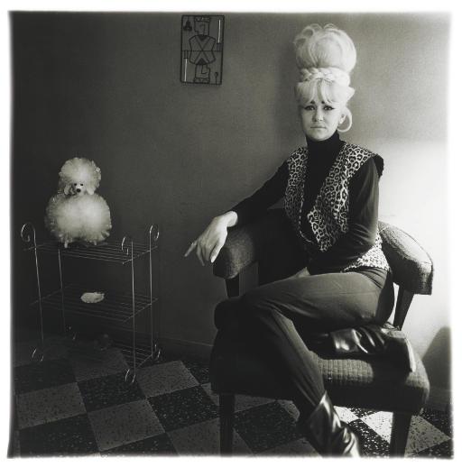 Diane Arbus - Lady bartender at home with a souvenir dog, New Orleans, La., 1964