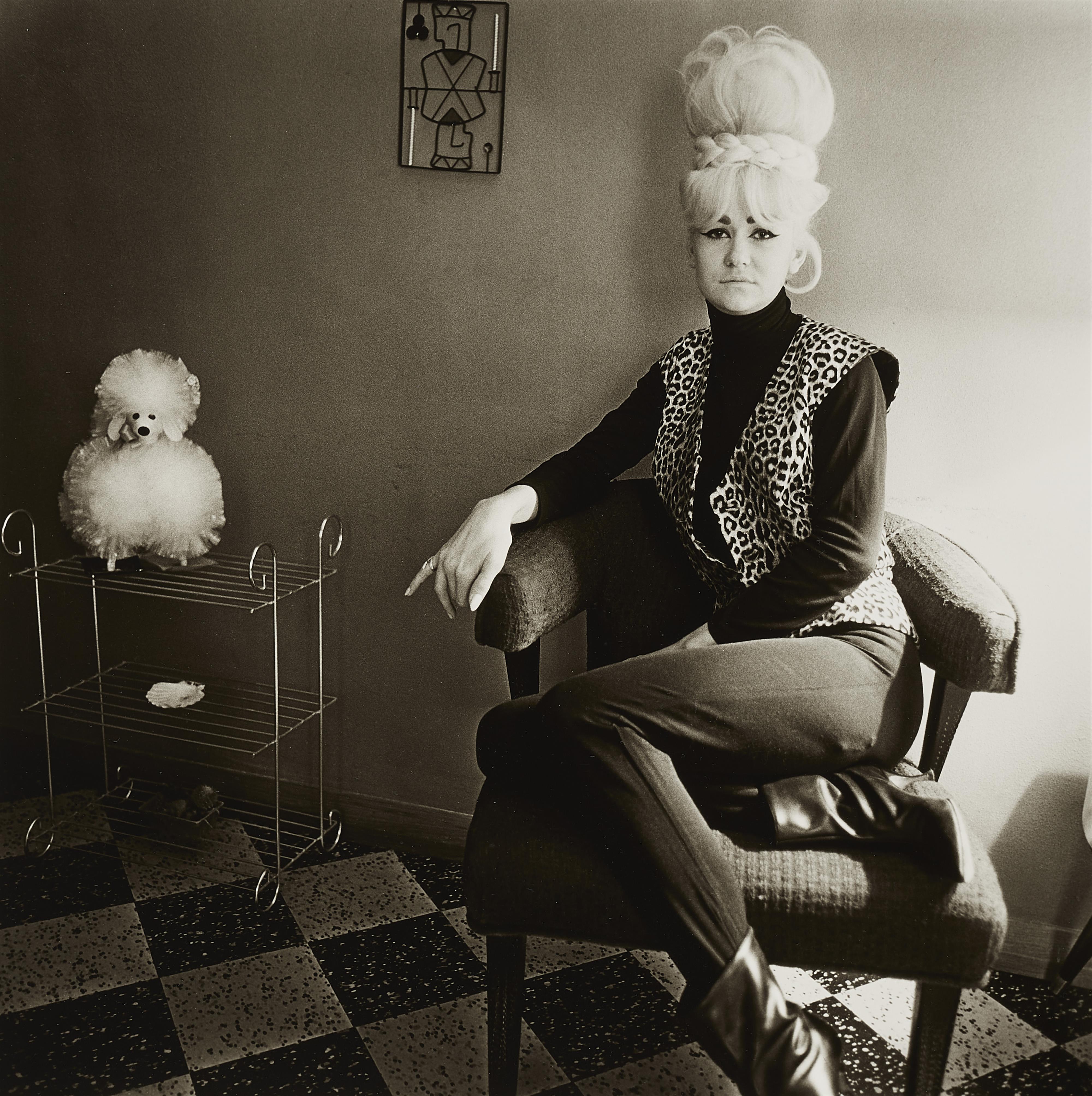 Diane Arbus - Lady Bartender at Home with a Souvenir Dog, New Orleans, LA