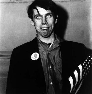 Diane Arbus - Patriotic young man with a flag, N.Y.C.