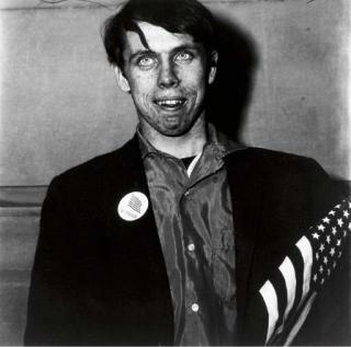 Diane Arbus - Patriotic Young Man with a Flag