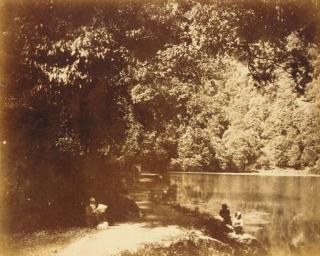 Dr. John Murray - Nynee Tal [View with Dr. John Murray reading beside the lake with his dog at his feet]