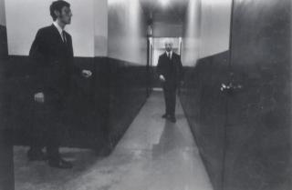 Duane Michals - Untitled (men in hall), c. 1975