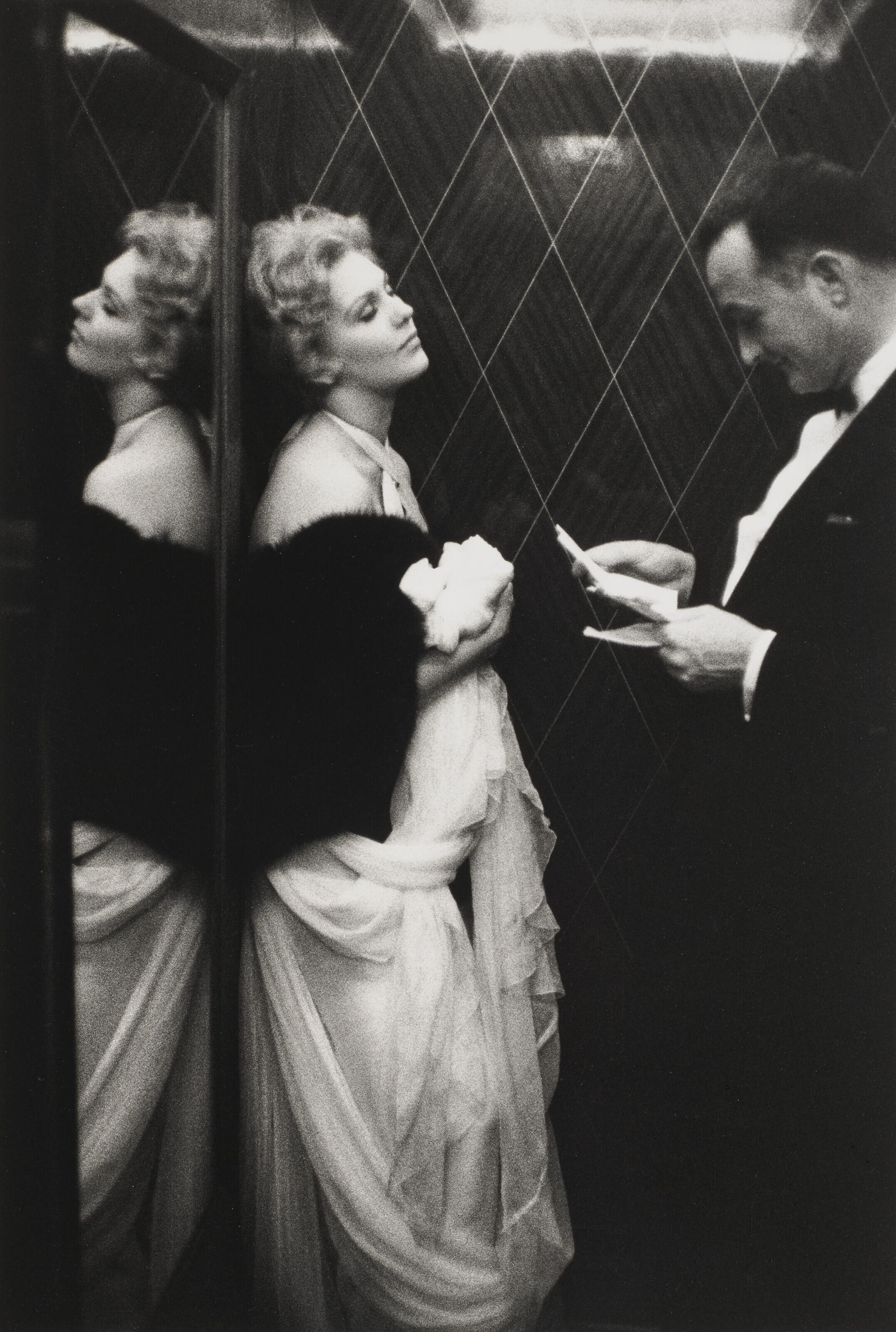 Edward Quinn - Kim Novak and Rupert Allan of Look Magazine in the lift of the Carlton Hotel, Cannes, 1956