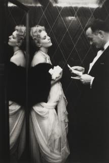 Edward Quinn - Kim Novak and Rupert Allan of Look Magazine in the lift of the Carlton Hotel, Cannes, 1956