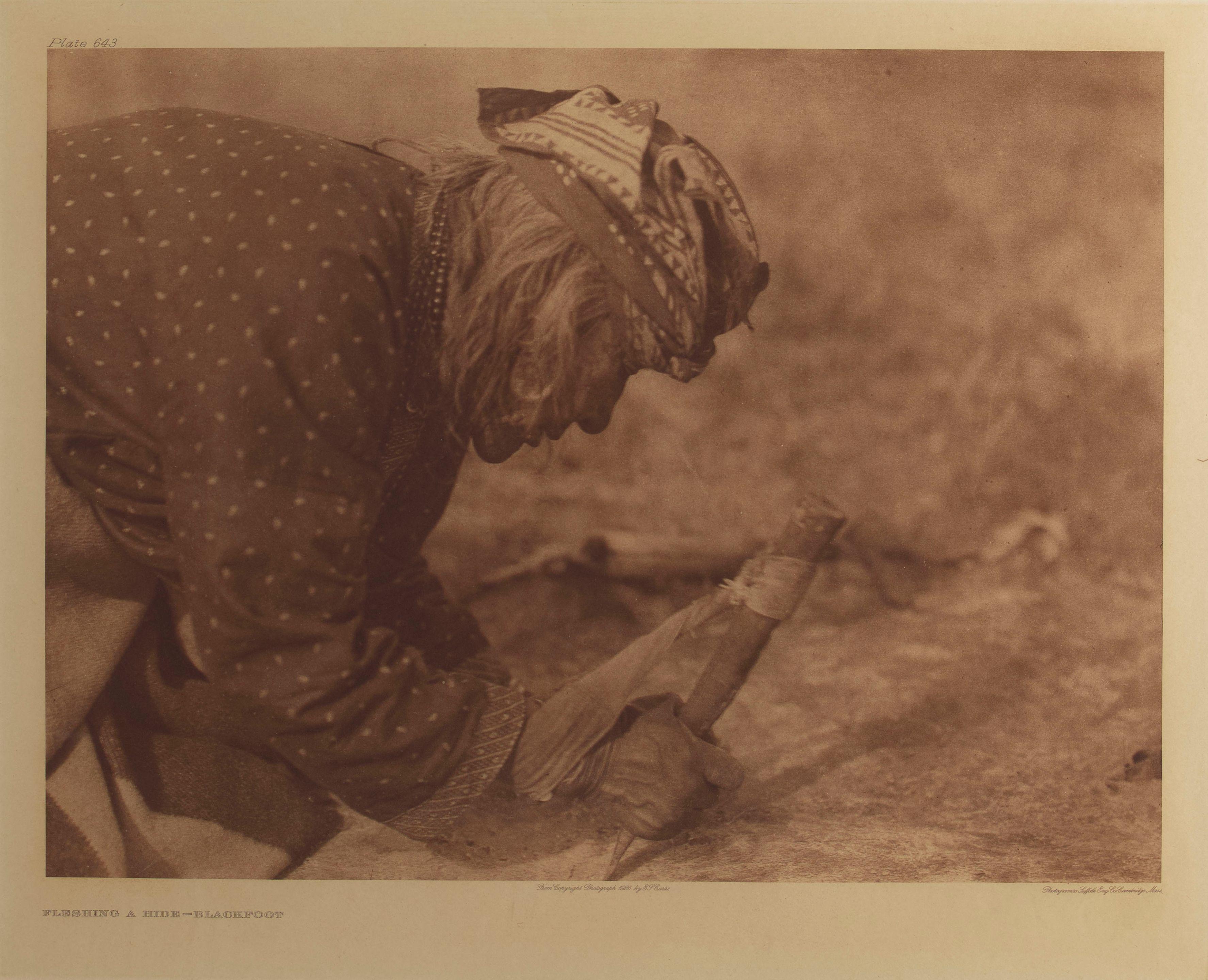 Edward S. Curtis - Fleshing a Hide - Blackfoot