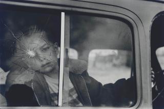 Elliott Erwitt - Child at Broken Window, 1969