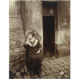 Eugène Atget - La Villette, Rue Asselin, Fille Publique Faisant Le Quart Devant Sa Porte, 1921
