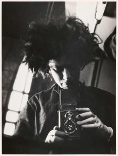 Eva Besnyö - Selfportrait with camera.