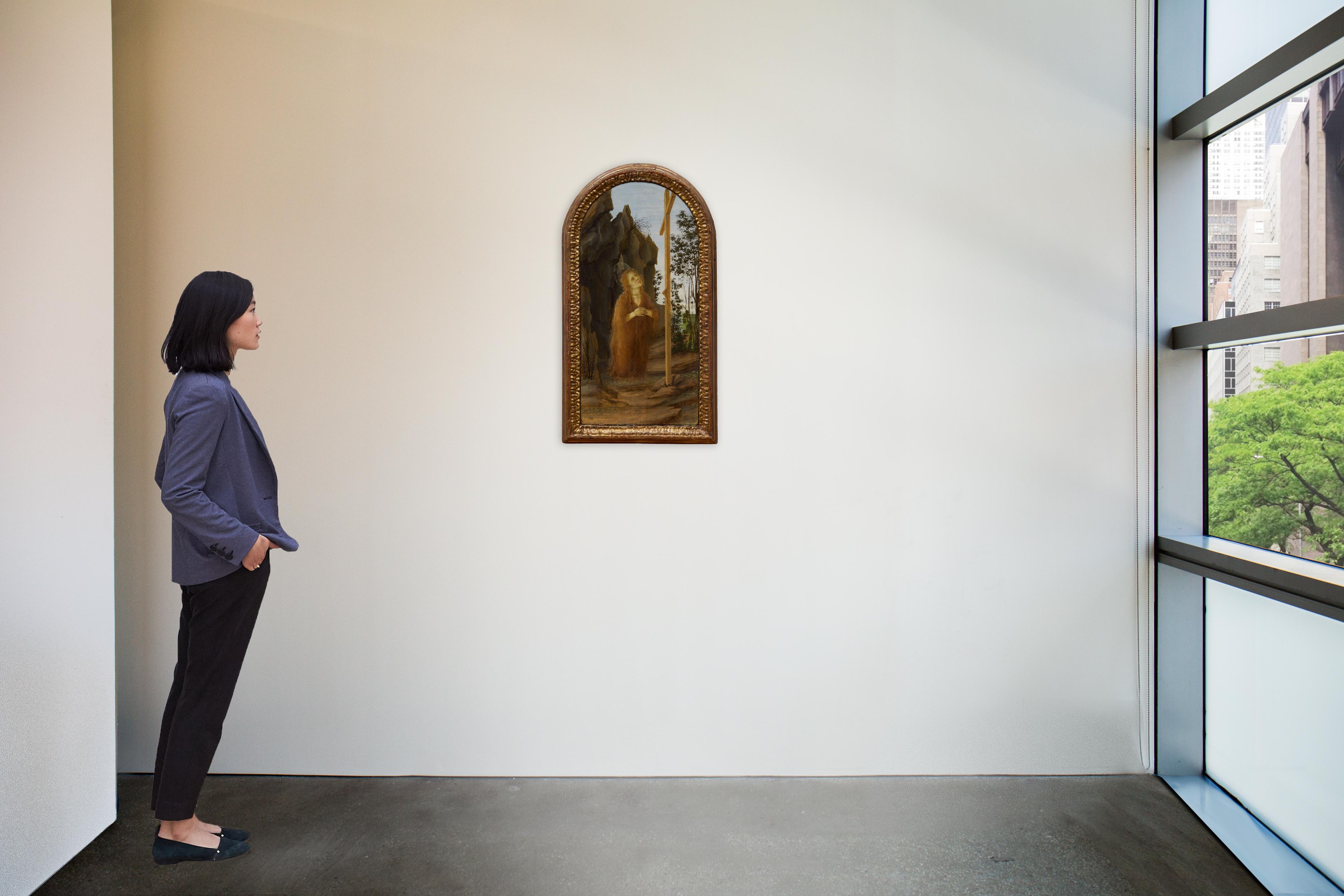 Filippino Lippi - Penitent Mary Magdalene adoring the True Cross in a rocky landscape