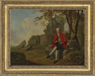 Francis Wheatley, R.A. - Portrait of a gentleman, full-length, in a crimson coat holding a walking cane and hat, seated in a landscape with ruins of a castle beyond